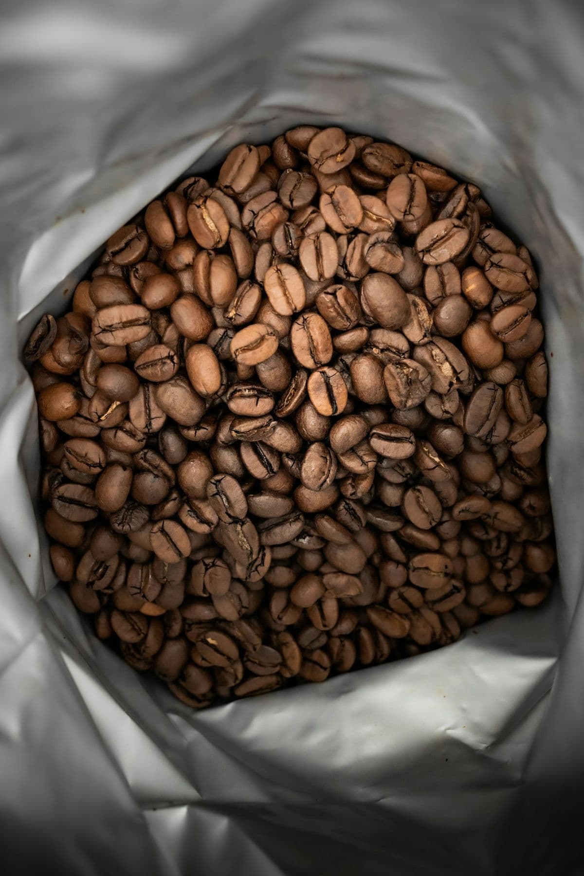 An open bag of roasted coffee beans