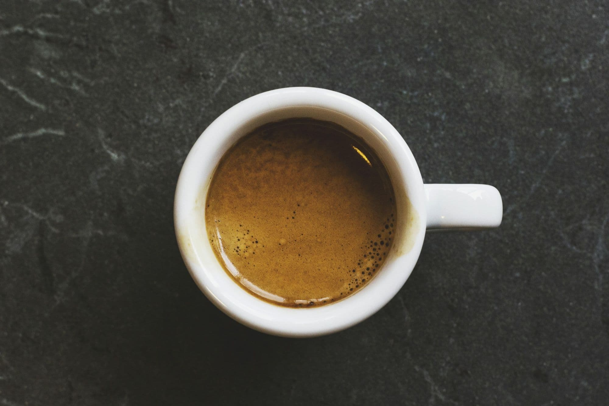 An espresso seen from above, crema on top