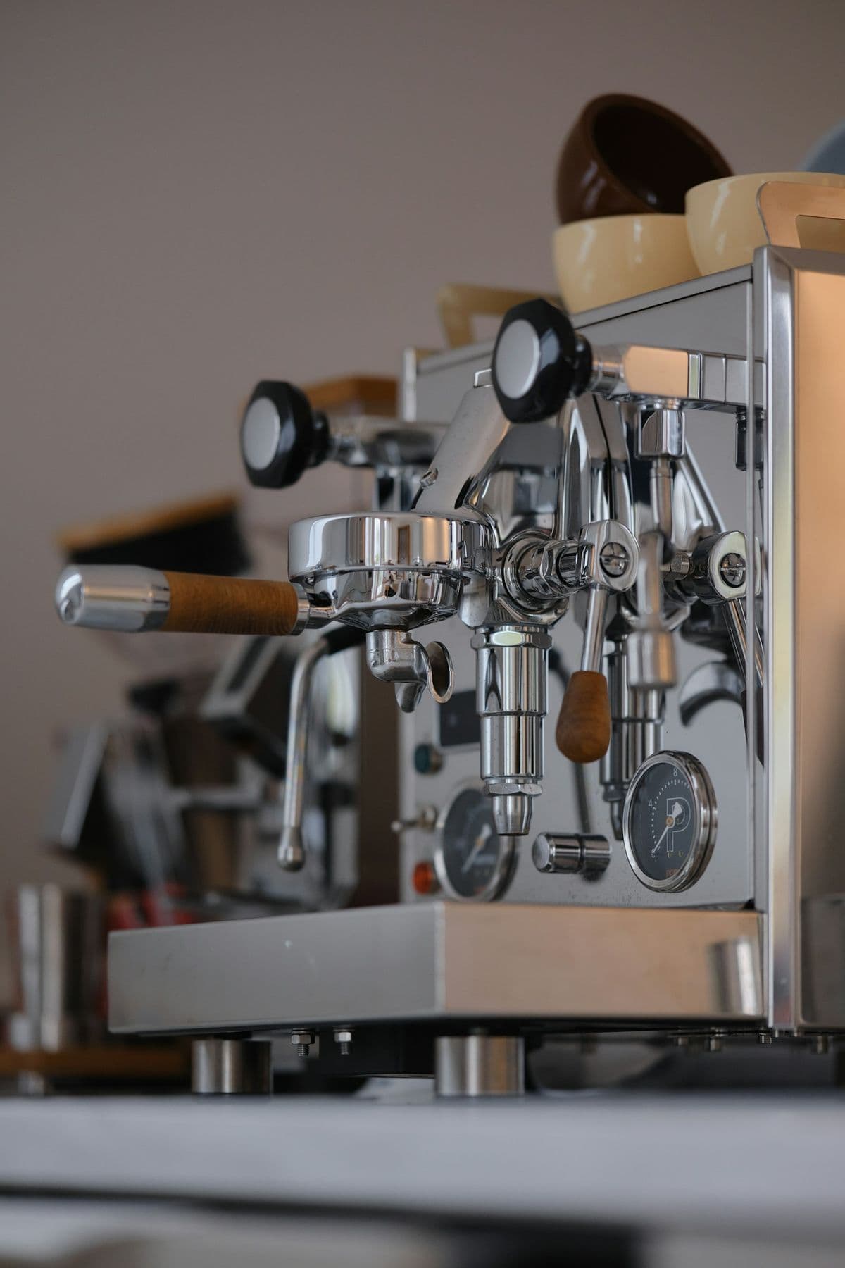 A chrome espresso machine on a kitchen counter